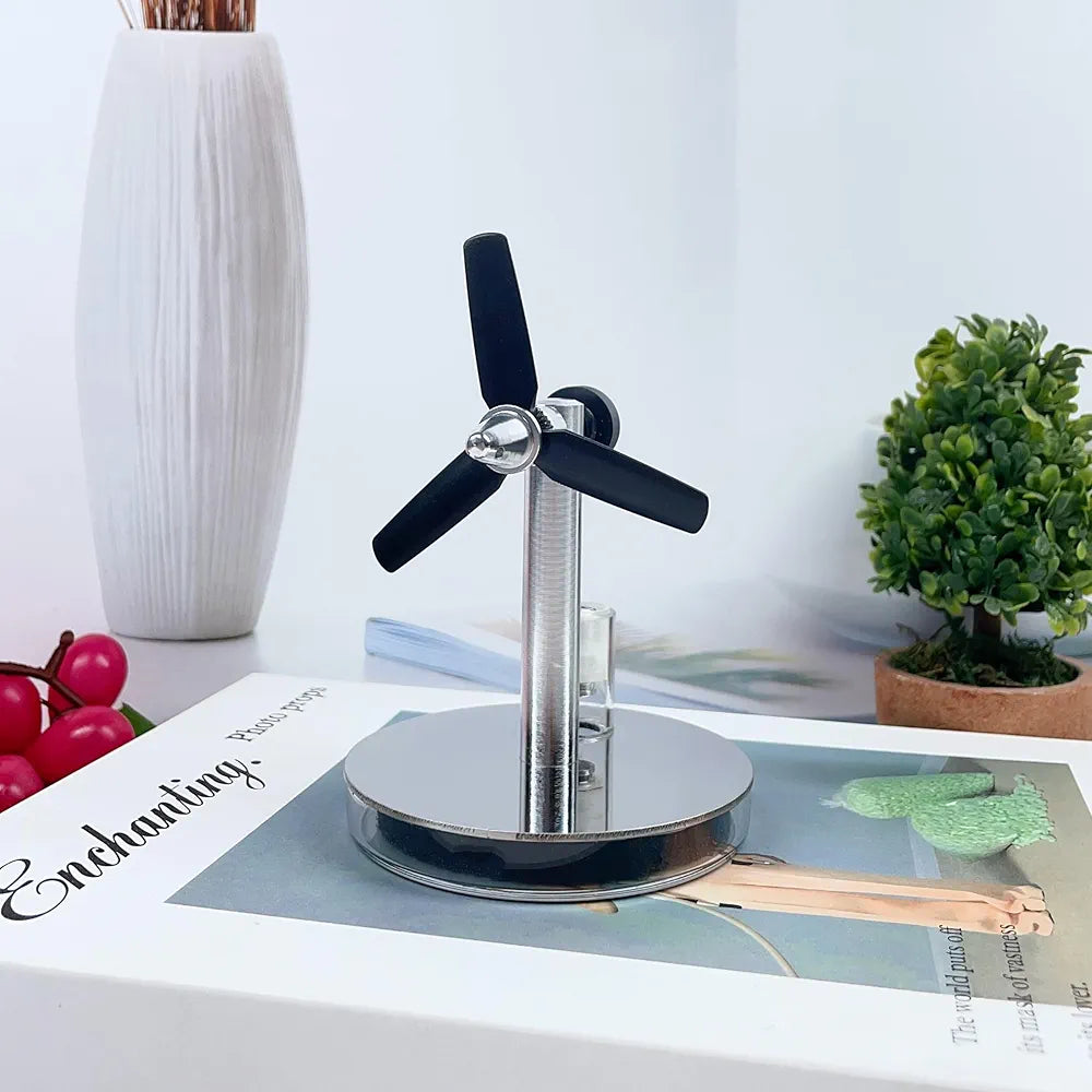 Mini low temperature Stirling engine by Stirling, showing detailed metal components and compact design on a white background.