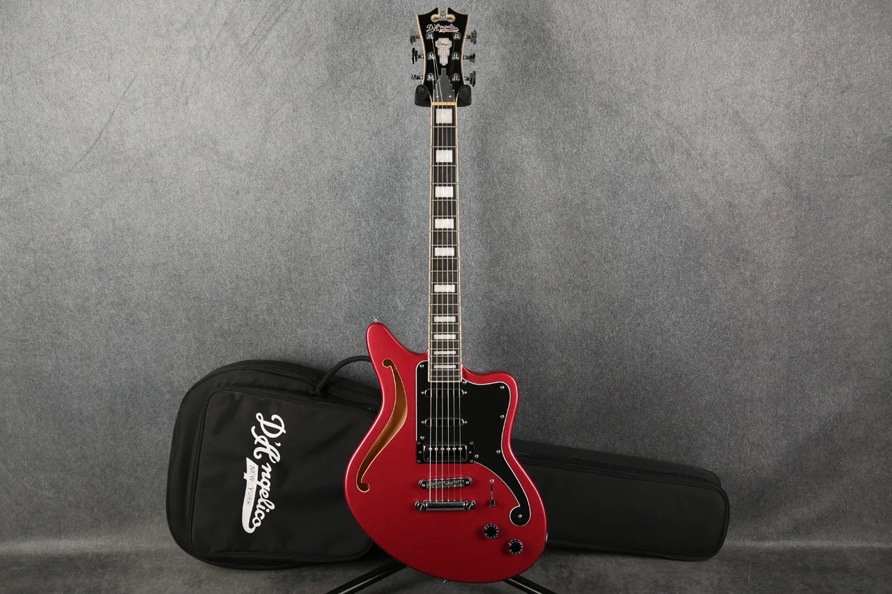 D'Angelico Premier Bedford guitar with an oxblood red finish, full front view showcasing its stylish design and hardware.