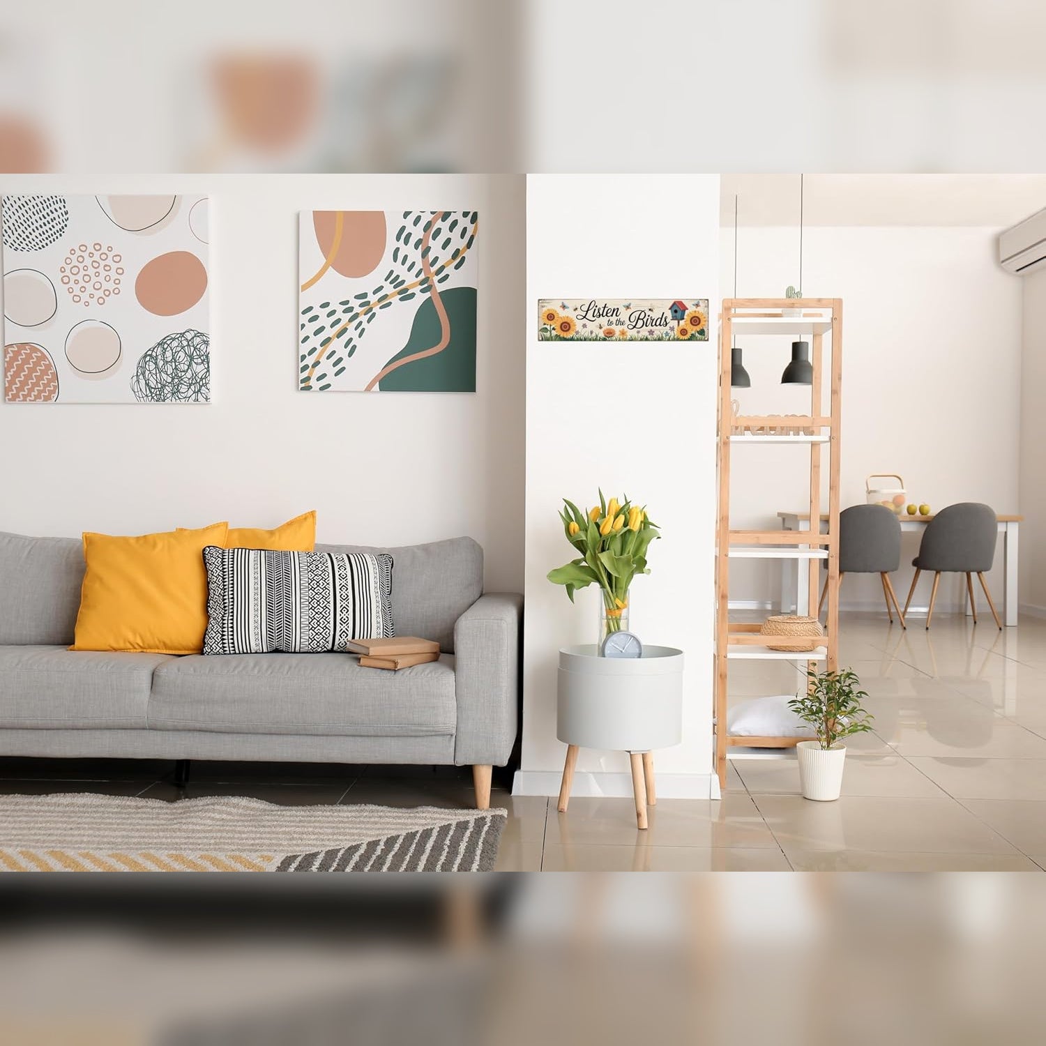 Modern living room with gray sofa, decorative pillows, and a wooden shelf. Beirut , Lebanon