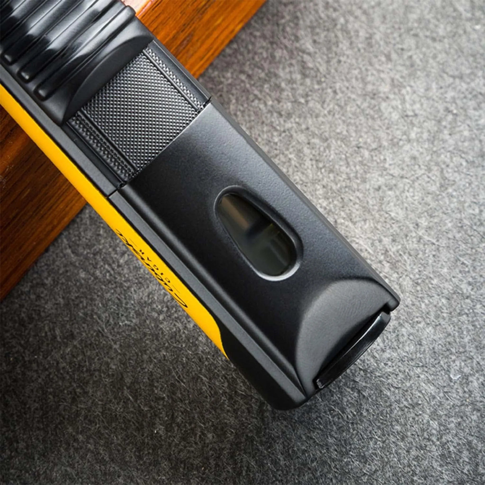 Yellow Lubinski cigar jet lighter with side window showing fuel level and sleek design.