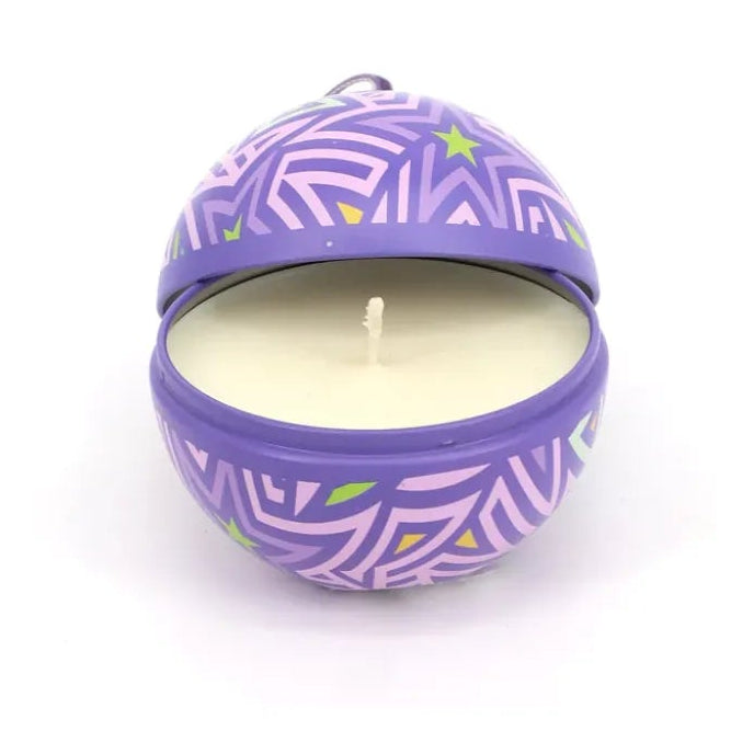 Purple candle with decorative design on a white background