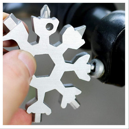 Metal snowflake-shaped tool being used on a drill bit