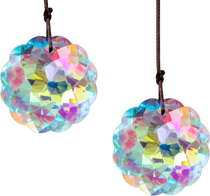 VOT Certified crystal suncatcher with datura-shaped prisms hanging in sunlight, creating colorful light reflections.