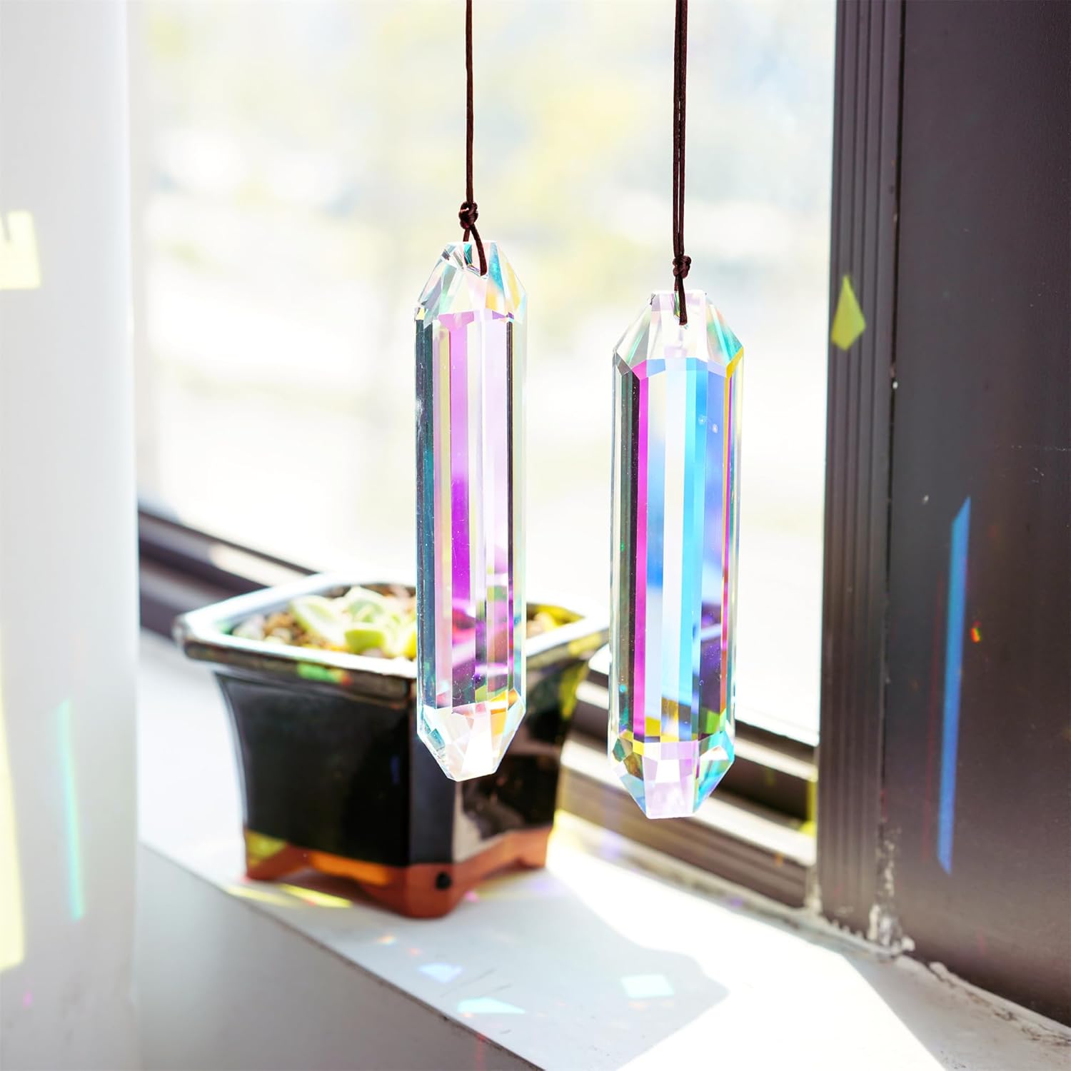 Large 5-inch VOT Certified crystal sun catcher prism with colorful reflective surfaces, ideal for window decoration and light refraction.