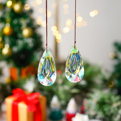 VOT Certified 3.5-inch crystal prism sun catcher hanging with rainbow reflections on a window.
