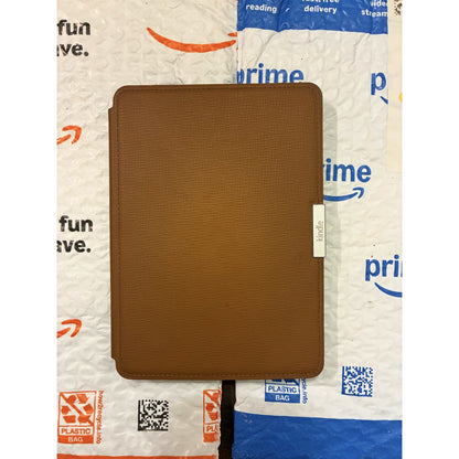 Amazon Kindle PaperWhite 7th generation e-reader with glare-free display and built-in light, shown in a close-up image.