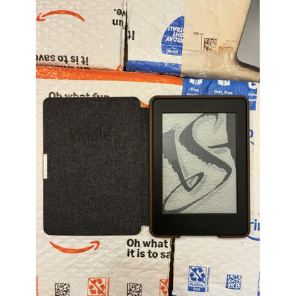 Amazon Kindle PaperWhite 7th generation ebook reader with white front and black back, showing screen display and sleek design.