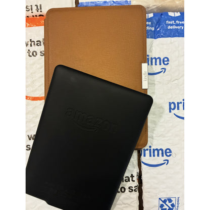 Amazon Kindle PaperWhite 7th generation e-reader with white bezel and screen display, showcasing a sleek, lightweight design.