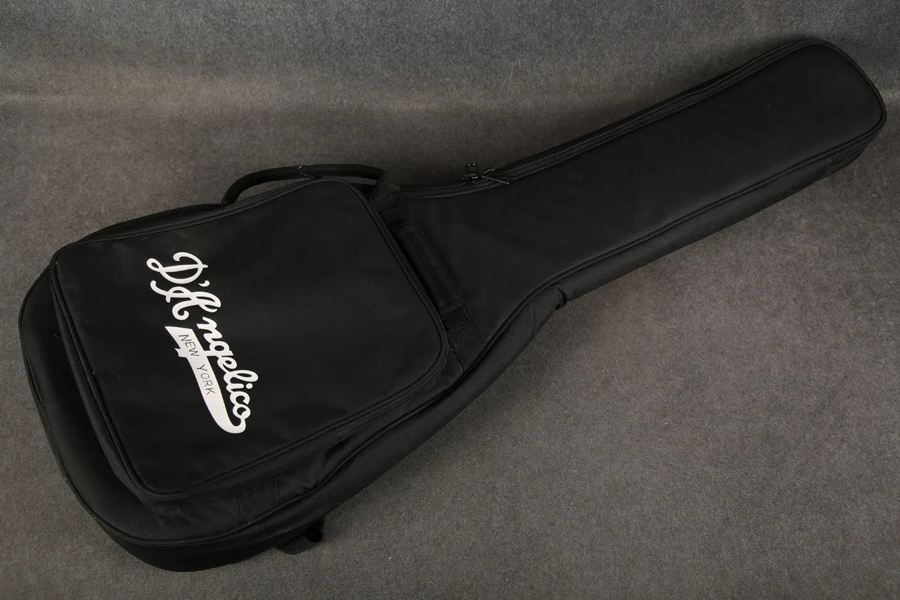 D'Angelico Premier Bedford guitar with oxblood red finish resting in a gig bag, showcasing its sleek design and quality craftsmanship.