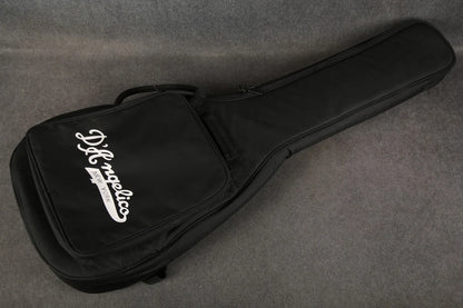 D'Angelico Premier Bedford guitar with oxblood red finish resting in a gig bag, showcasing its sleek design and quality craftsmanship.