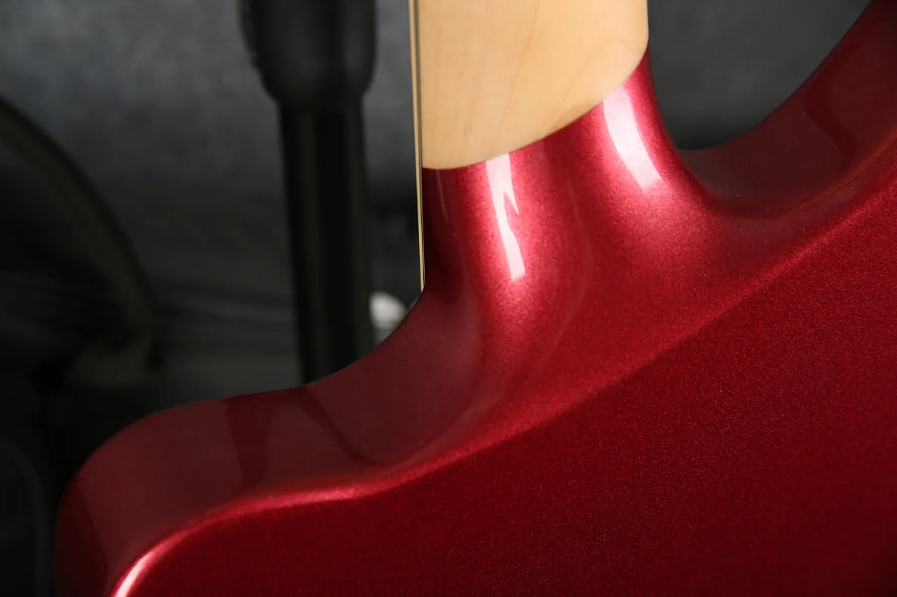Close-up of the D'Angelico Premier Bedford guitar neck in oxblood red, showcasing the detailed wood grain and finish.