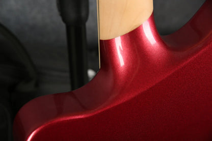 Close-up of the D'Angelico Premier Bedford guitar neck in oxblood red, showcasing the detailed wood grain and finish.