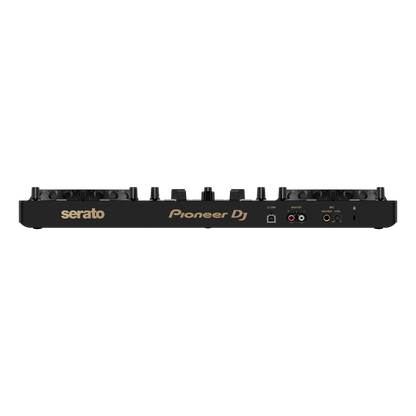 Pioneer DJ DDJ-REV1-N Serato performance DJ controller in limited-edition gold, showing rear view with knobs and connection ports.