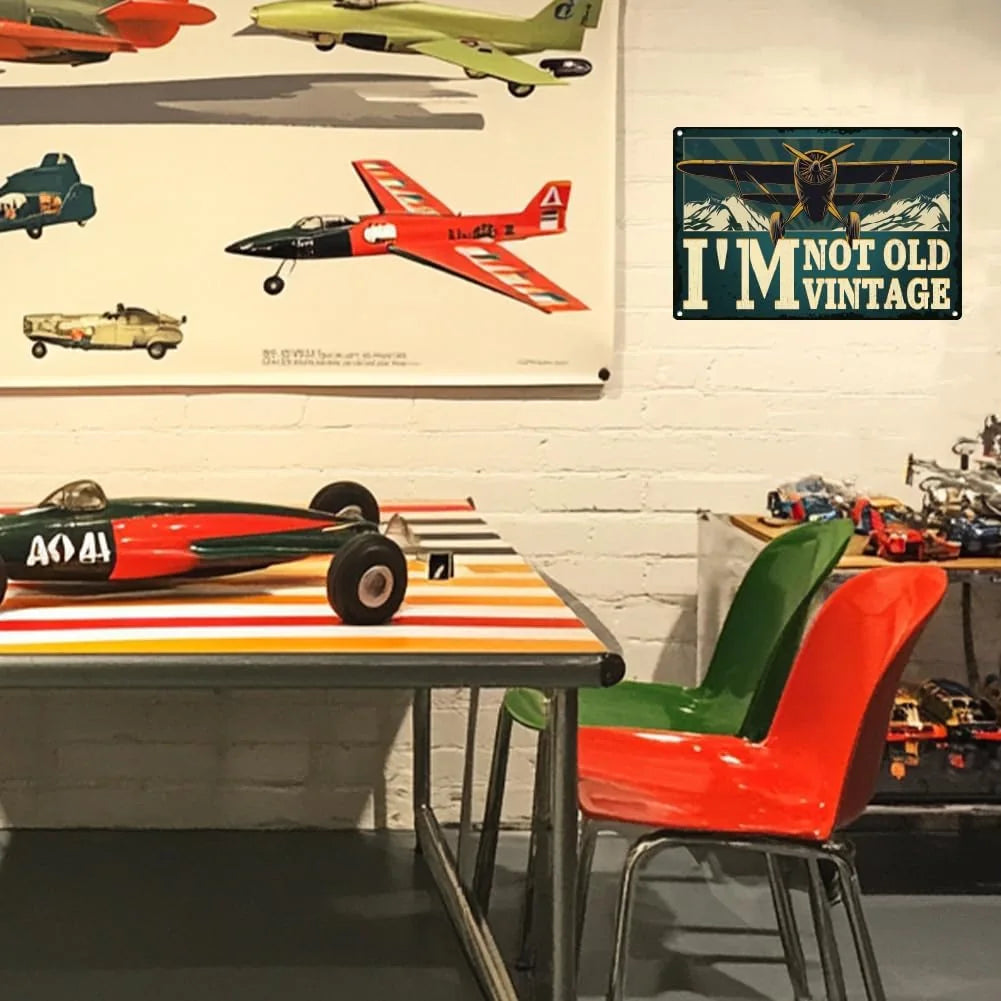 Vintage VOT Certified Tin Sign featuring aviation design, perfect for garage or wall decor with a retro airplane theme.