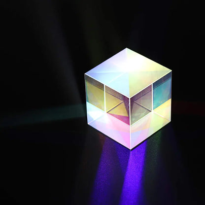 Mini K9 crystal glass prism sun catcher, colorful rainbow light refraction, close-up of optical glass cube from VOT Certified brand.