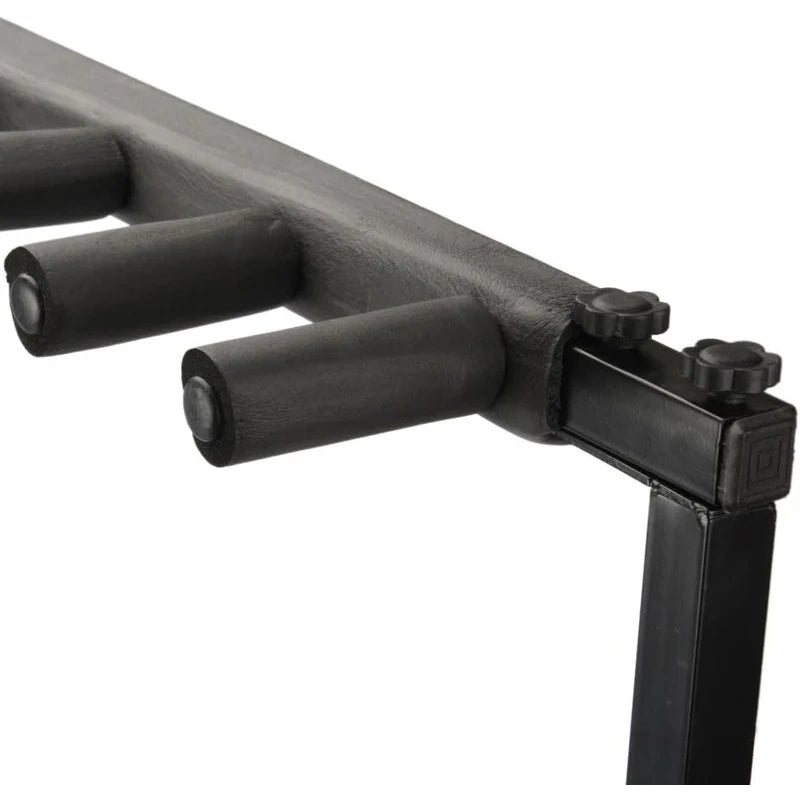 Close-up of a black metal rack or stand with cylindrical support arms and adjustment knobs on a white background.