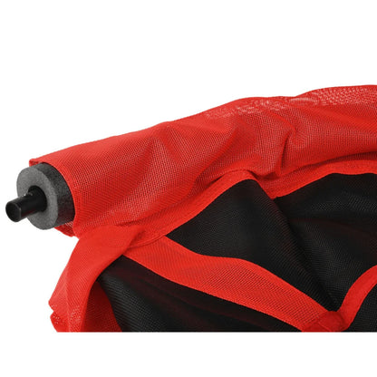 Close-up of a red and black garden hose with nozzle on a white background