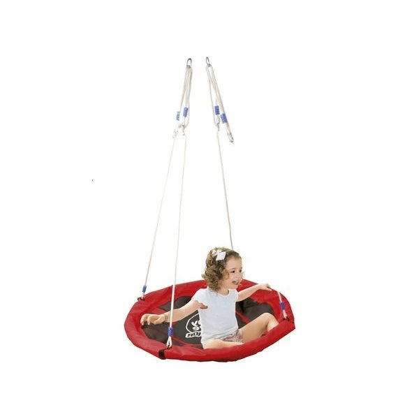 Child sitting on a red and black swing seat with white background