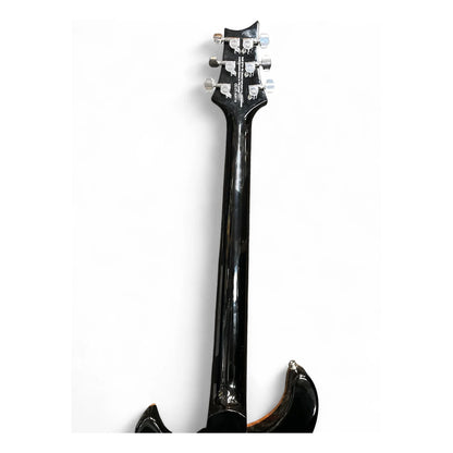 Close-up of the headstock and upper neck of a glossy black electric guitar against a plain white background.