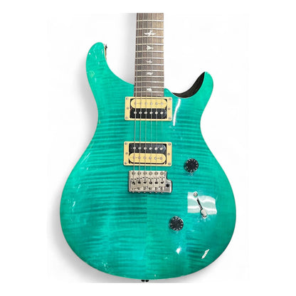 A turquoise electric guitar with a flamed maple top, gold hardware, and a dark fretboard, shown against a plain white background.