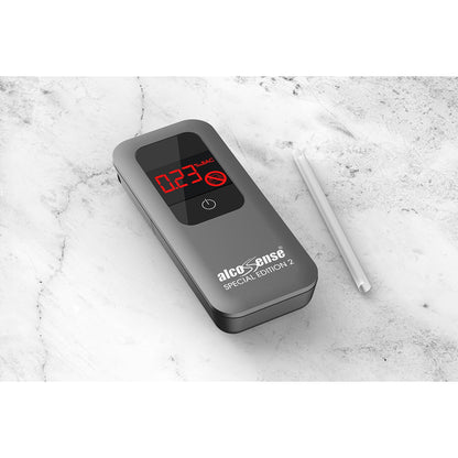 AlcoSense SE2 alcohol breathalyzer appliance on a marble table with a white background, showing its sleek design and digital display.