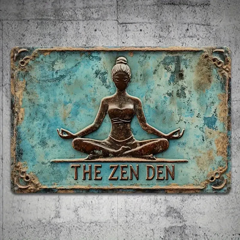 Decorative sign with a meditating figure and 'The Zen Den' text on a textured wall background.