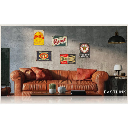 Set of 5 vintage tin double-sided PVC garage signs displayed on a living room wall, featuring classic oil-themed designs.